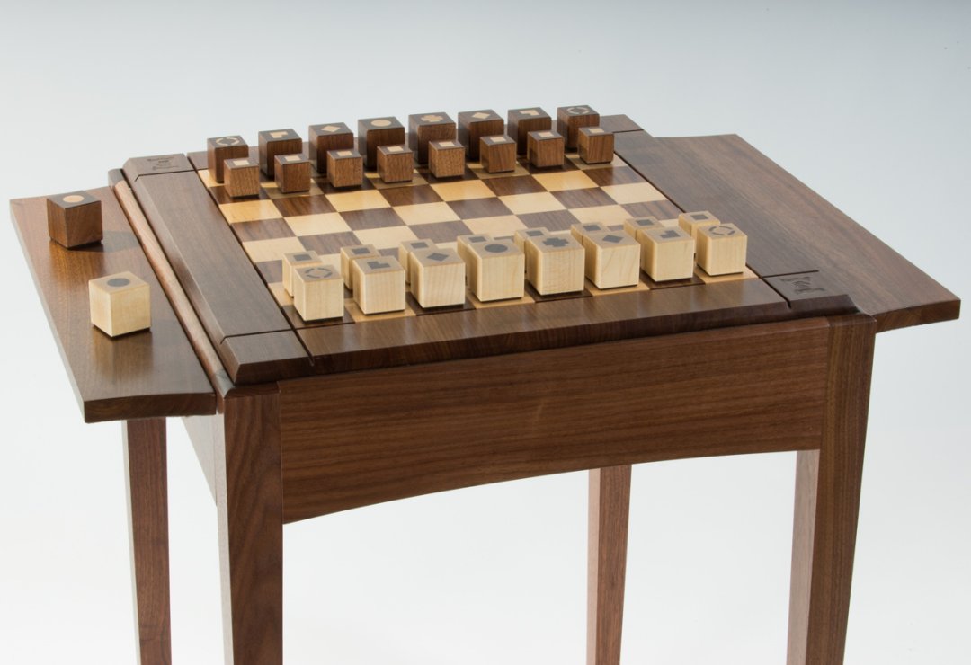 Chess table with in-house design pieces setup.