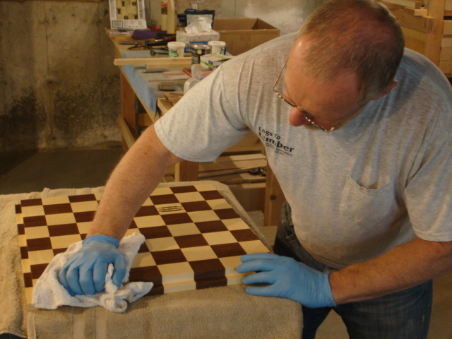 Putting the finishing touches on the Summerville-New England Chessboards